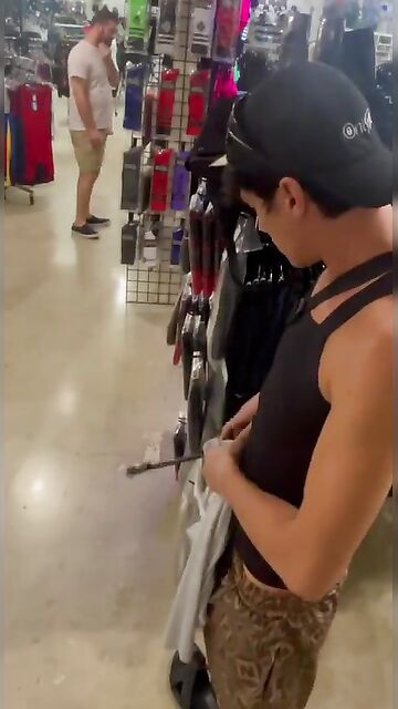 Crazy twink show his cut cock in public in a retail shop