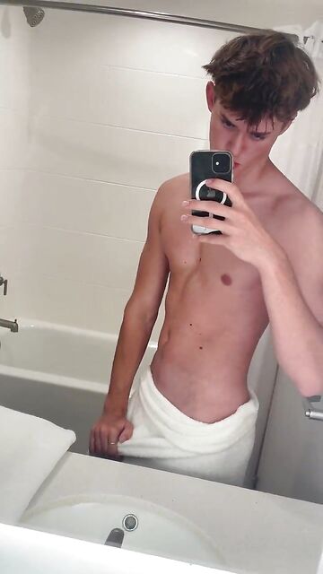 Really hot guy hides a huge bulge under the towel