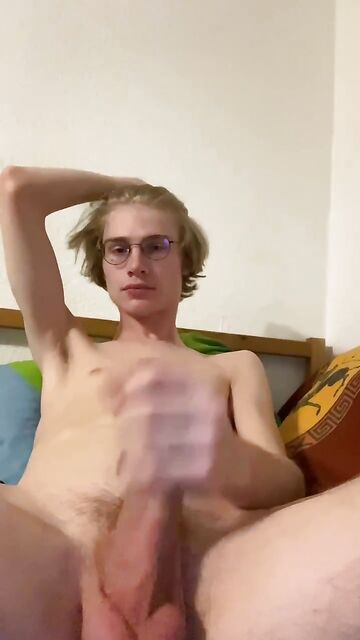 Blond 19yo guy with glasses shows his big balls and his thick hary uncut cock