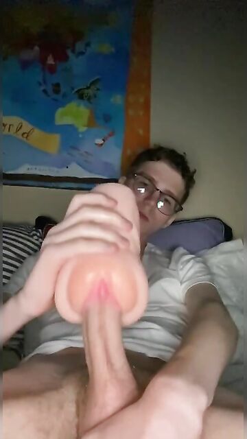 18yo geek with a monster cock plays with a fleshlight and cums into it