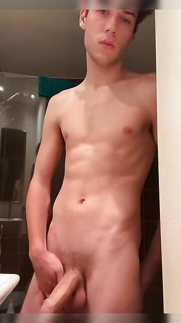 20-year-old boy with a beautiful face jerks off completely naked shows off his thick cock