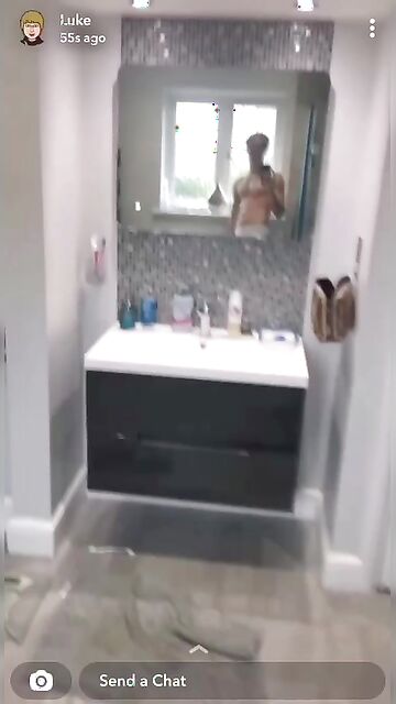 Blond fit twink boy flexes in muscle at the mirror and films it with his phone