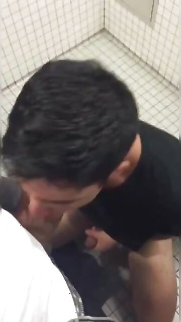 Horny student sucks his class mate hidden in the toilet of the college gym