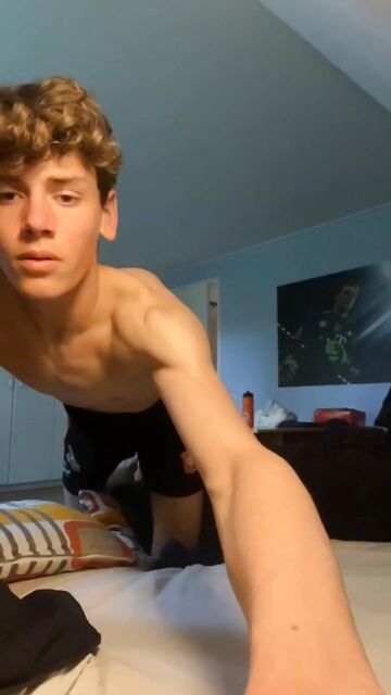 Curly, skinny boy takes off his pants and jerks off his cock when his parents are out